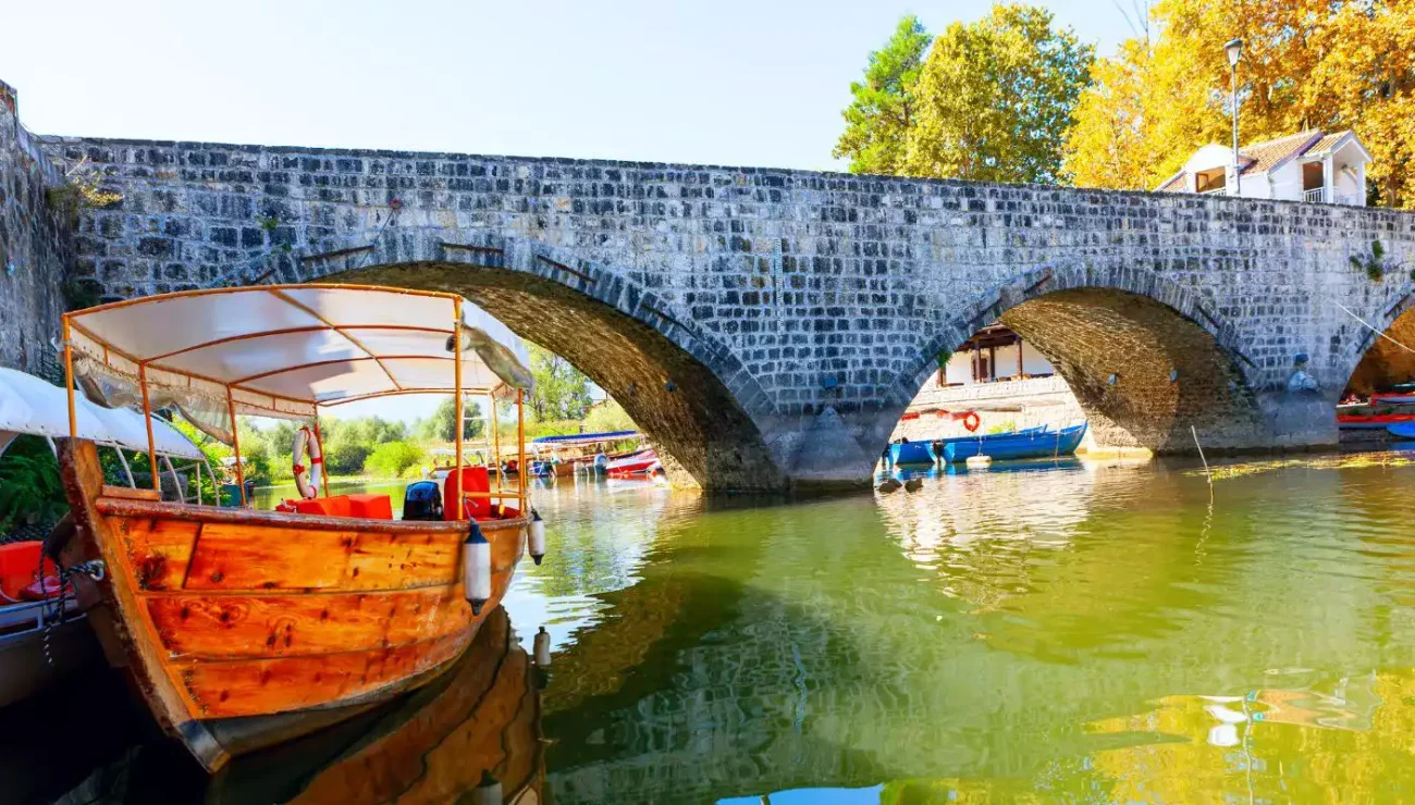 Old stone bridge over the Crnojević River in Rijeka Crnojevića, Montenegro